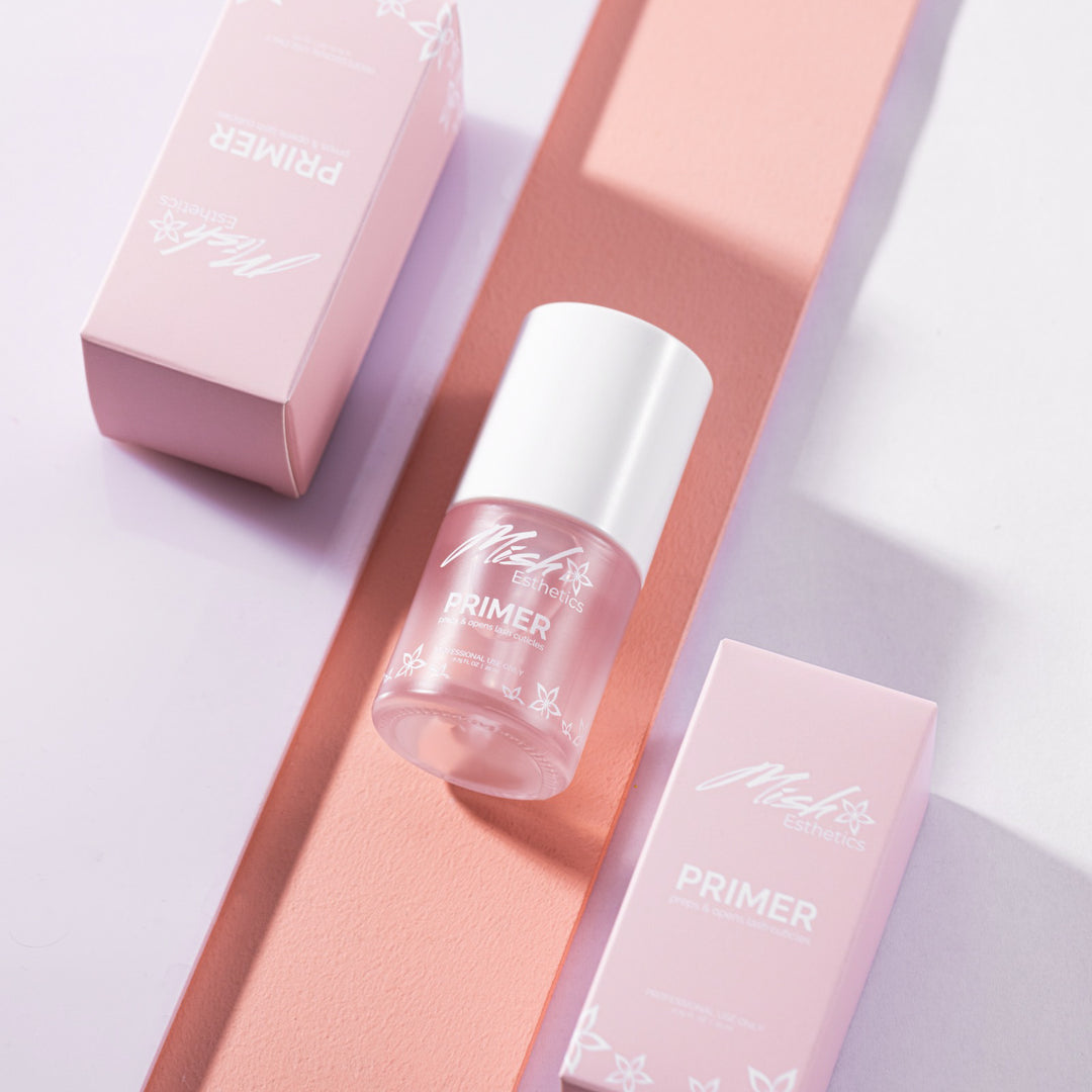 Prime lash bottle and box on pink surface