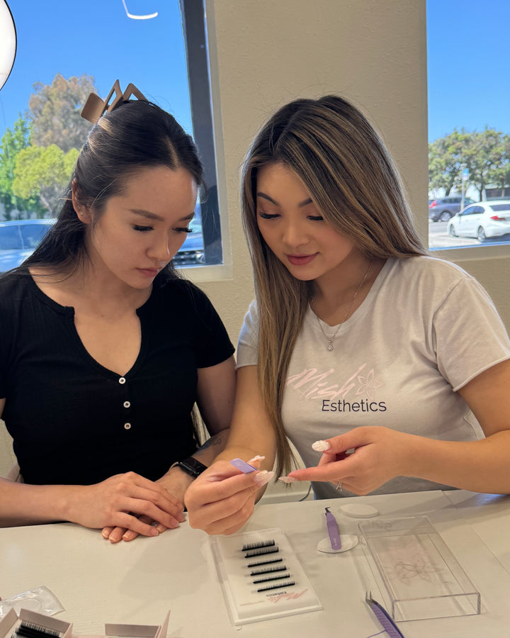 An action shot of Mish delivering a lash extension training privately